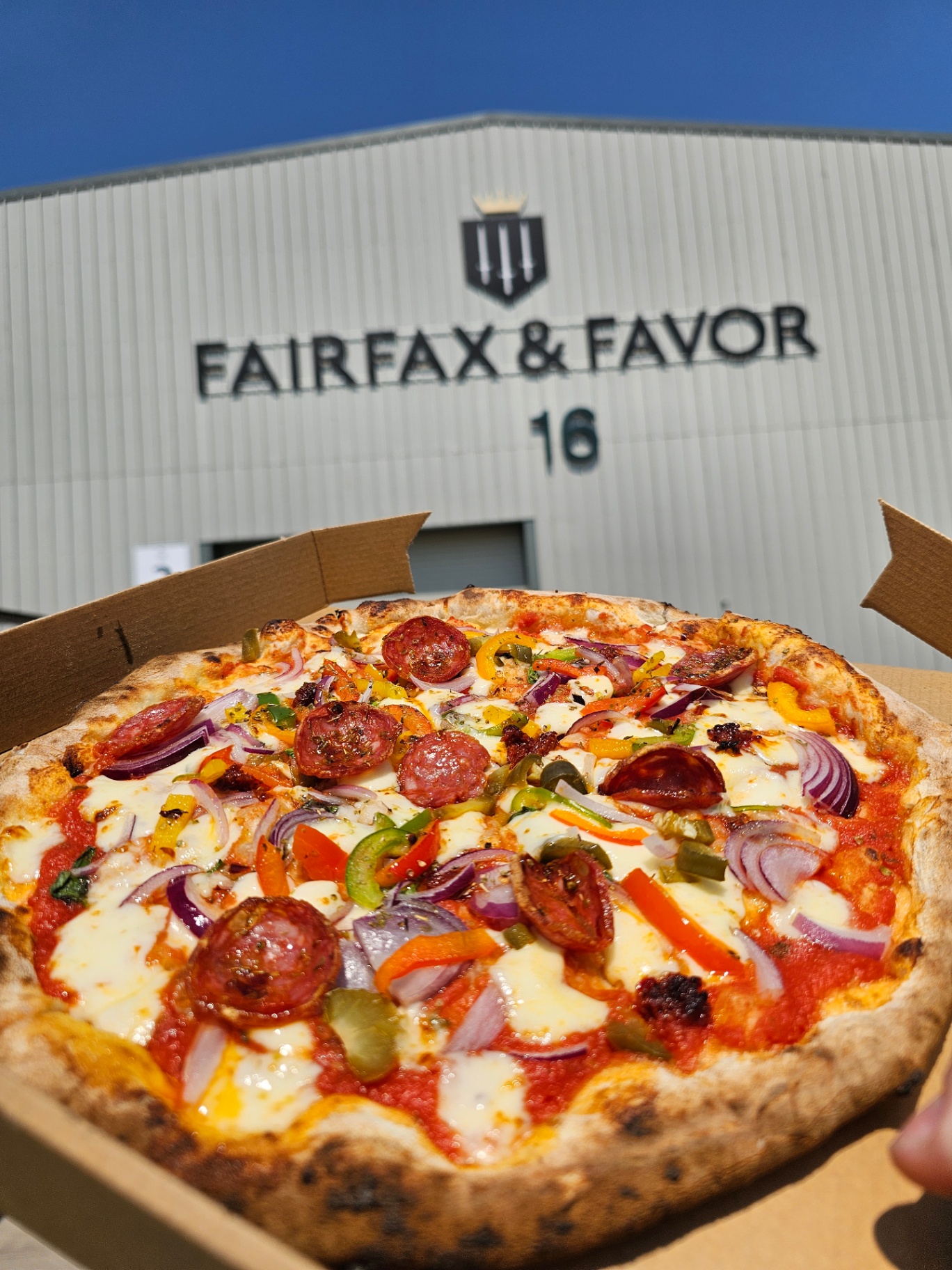 Pepperoni and pepper pizza outside Fairfax & Favor — corporate hospitality